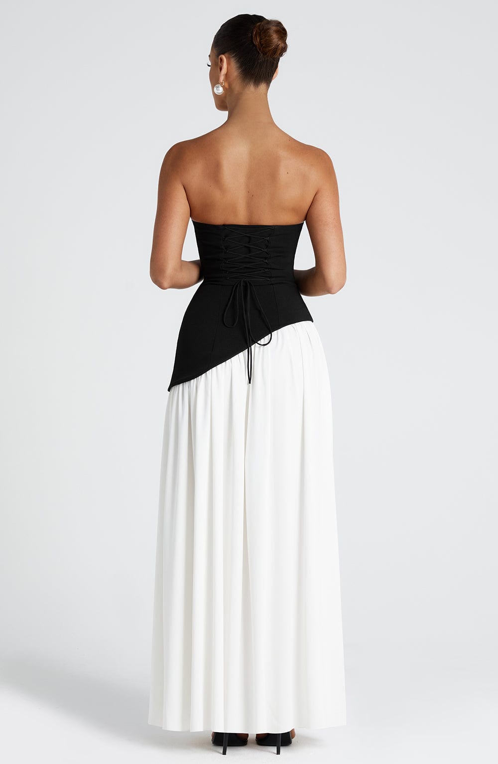 Two-tone strapless maxi dress with black bodice and white flowy skirt