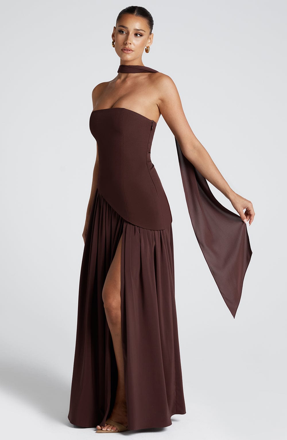 Dark red strapless maxi dress with draped skirt and side slit