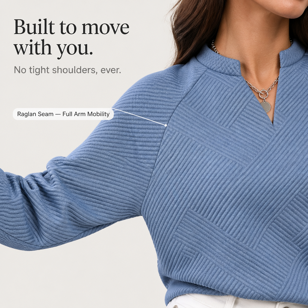 Dusty blue jacquard V-neck sweatshirt showing ribbed knit and textured stripe detail