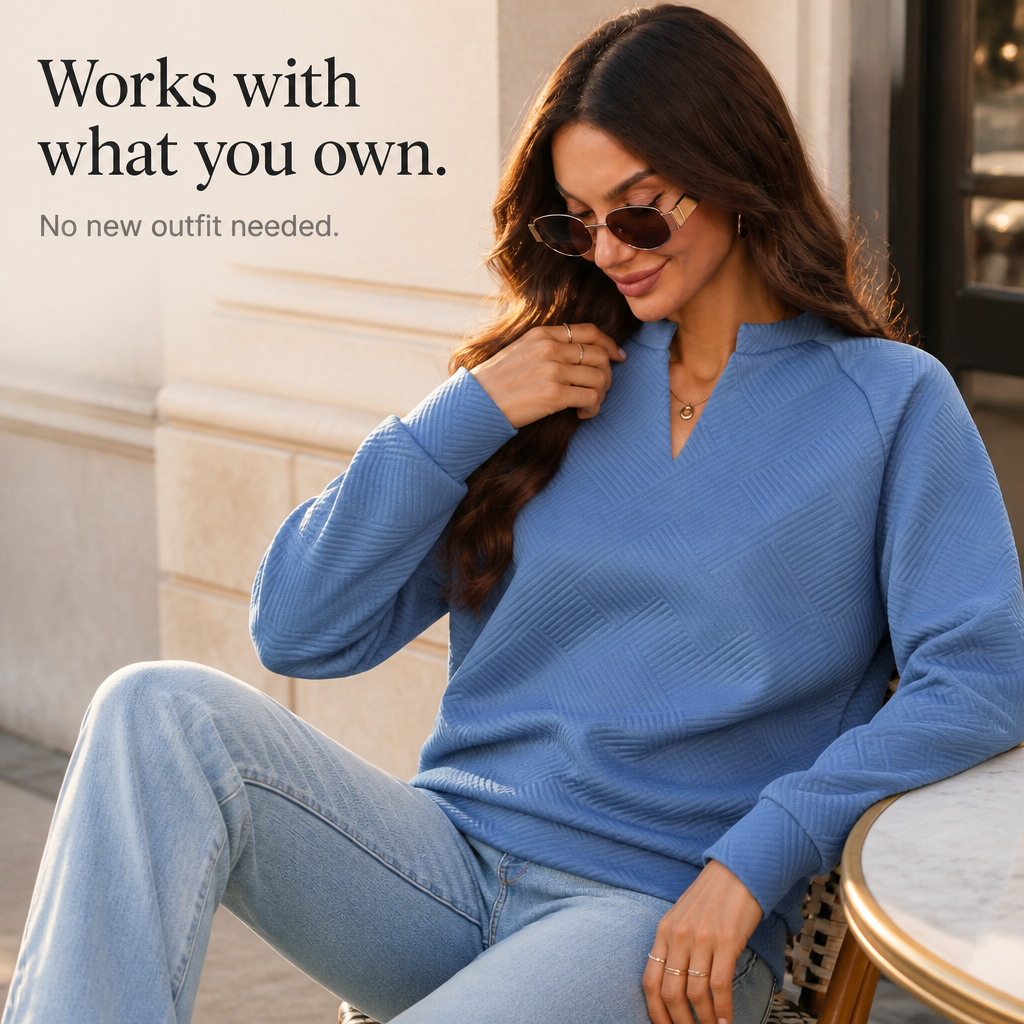 Dusty blue jacquard V-neck sweatshirt with textured stripe pattern at chest
