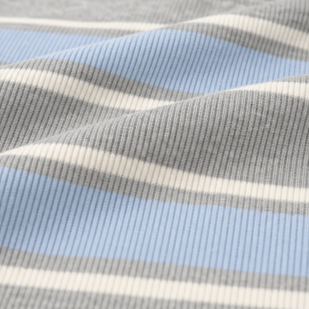 Close-up of blue, white, and heather gray striped knit fabric on the top