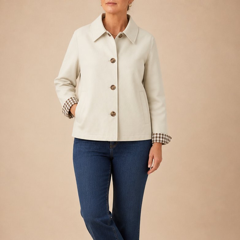 White raglan-sleeve casual coat with button front, collar, and plaid-cuffed sleeves