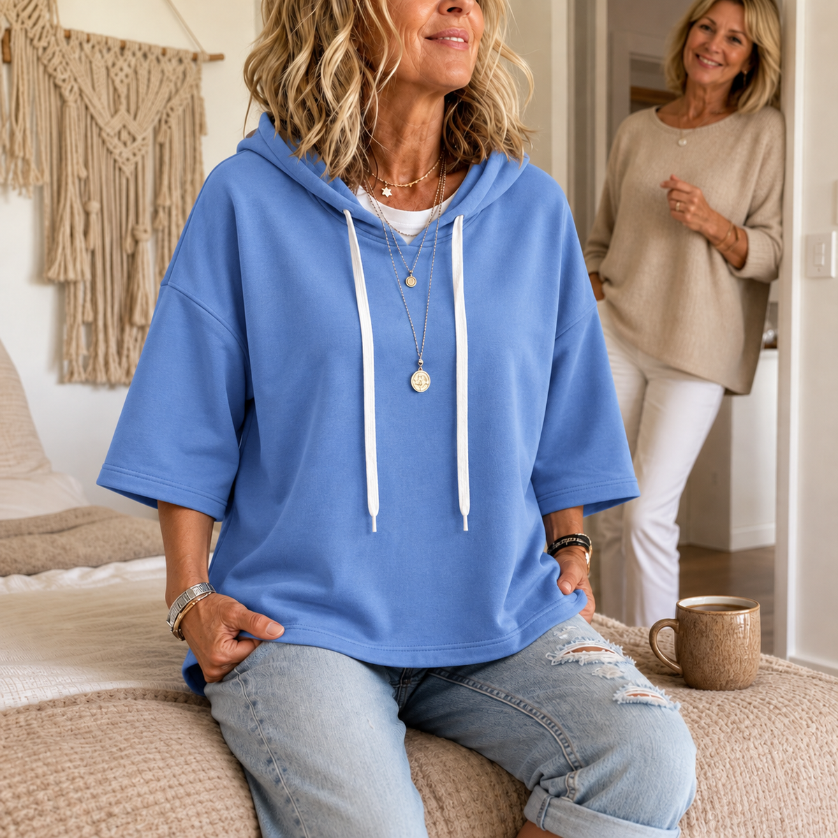 Blue three-quarter sleeve hoodie with drawstring hood and front pouch pocket
