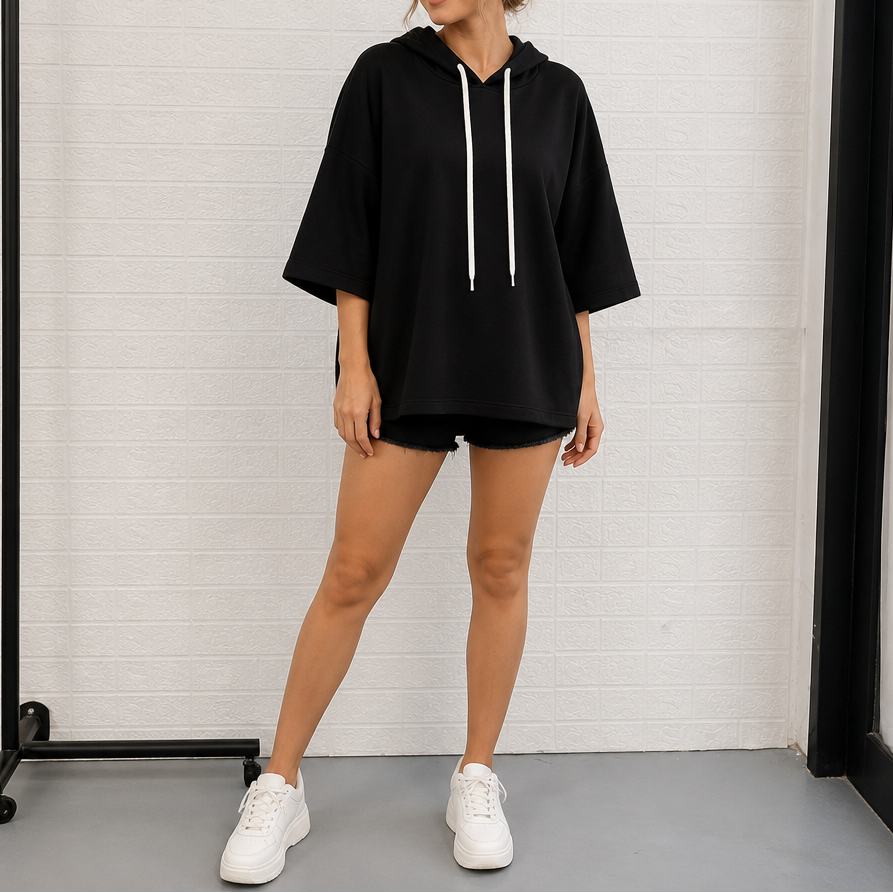 Black three-quarter sleeve hoodie with drawstring hood and white hanging strings