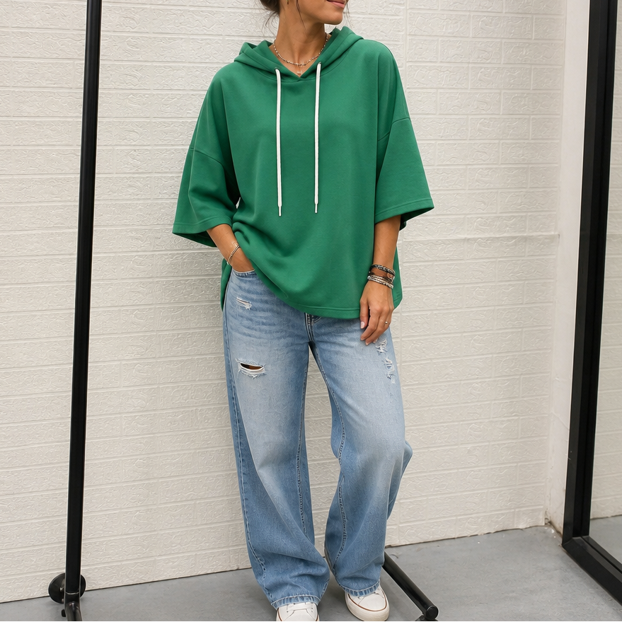 Green three-quarter sleeve hoodie with drawstring hood and white hanging strings