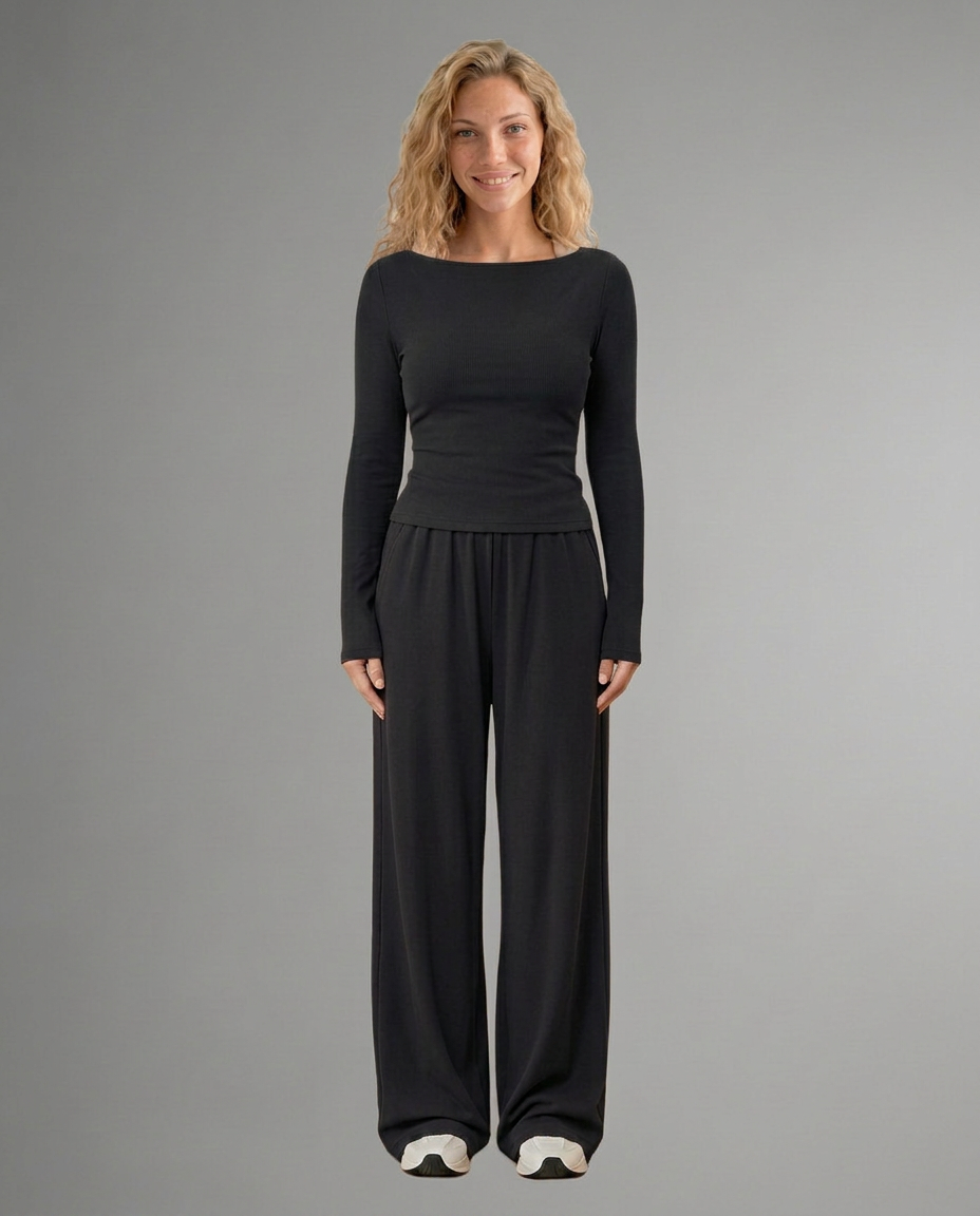 Two-piece set with black long-sleeve top and wide-leg trousers, front view.