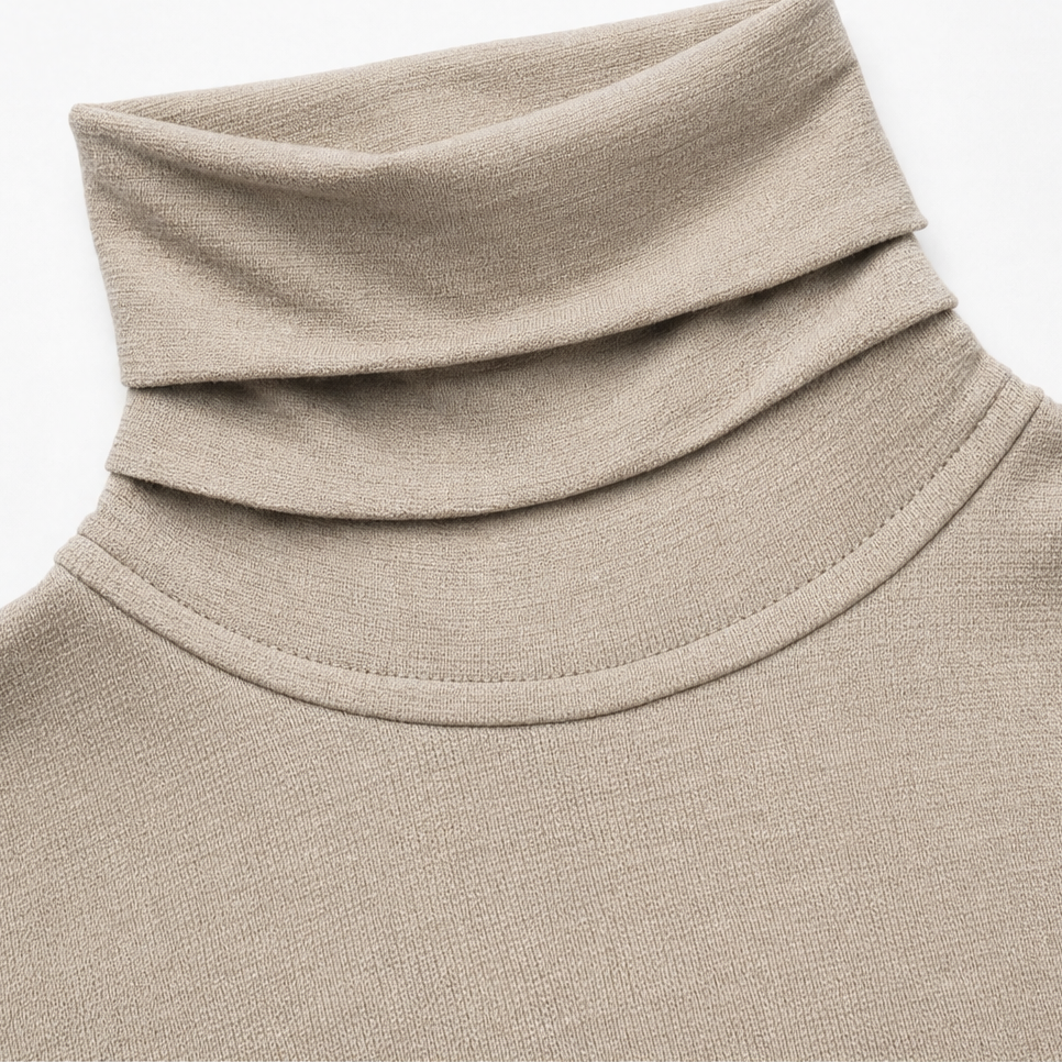 Taupe ribbed knit turtleneck with folded collar and smooth knit texture.