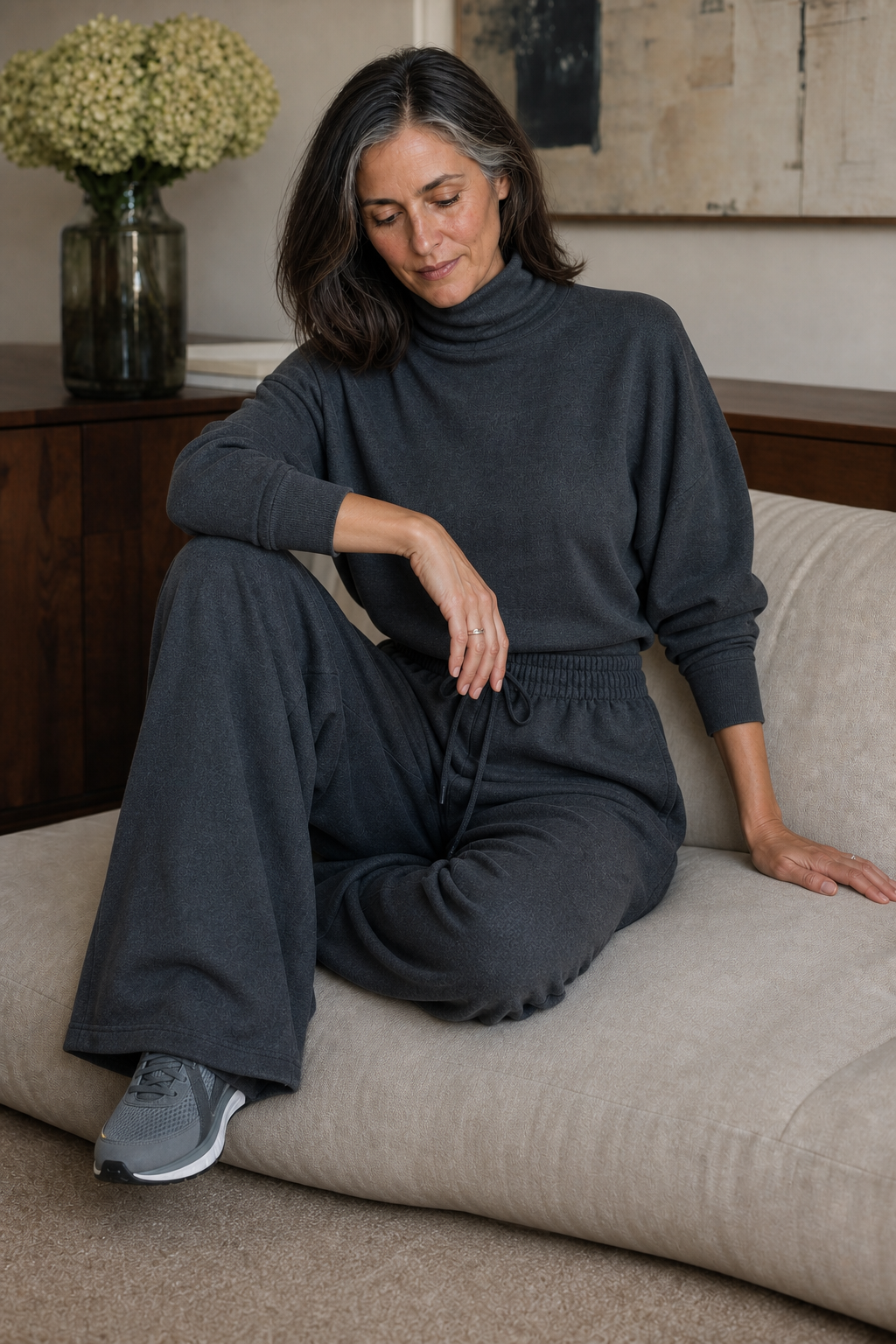 Dark grey knit turtleneck top and wide-leg pants set with cuffed sleeves and draped legs