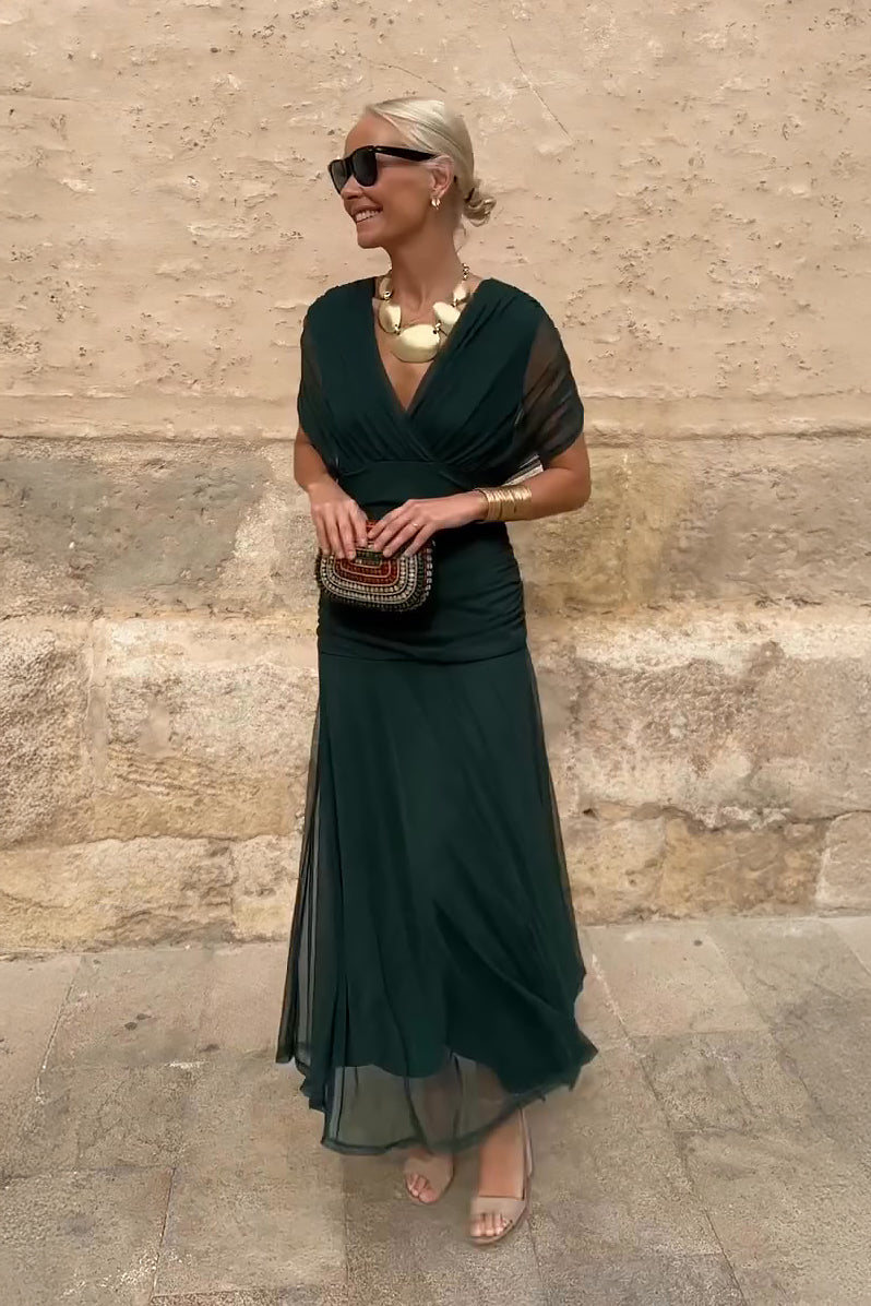 Green twist off-shoulder maxi dress with ruched bodice and flowing chiffon skirt