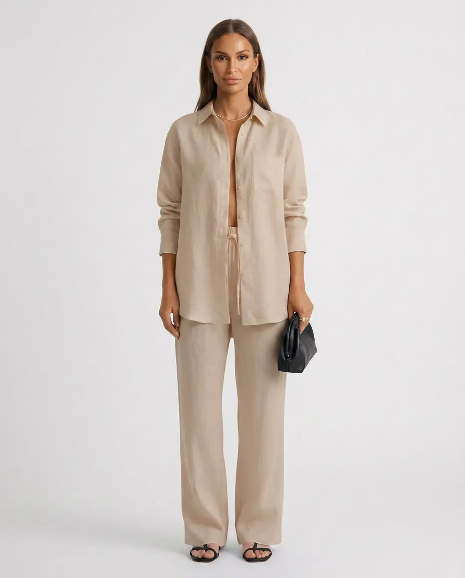 Beige two-piece button-up set with long-sleeve button shirt and relaxed matching pants