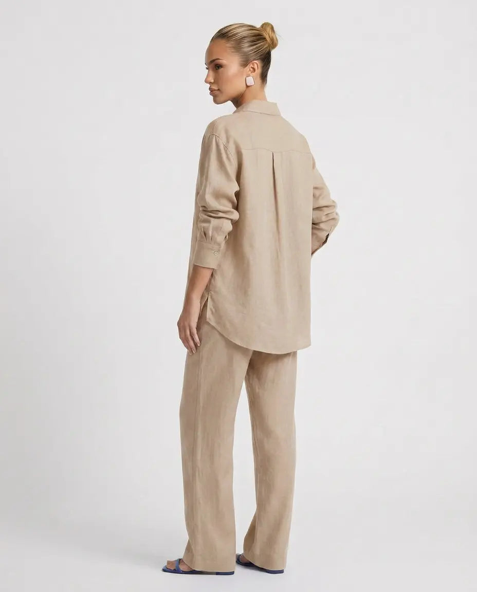 Beige two-piece button-up set with long-sleeve back button shirt and relaxed pants