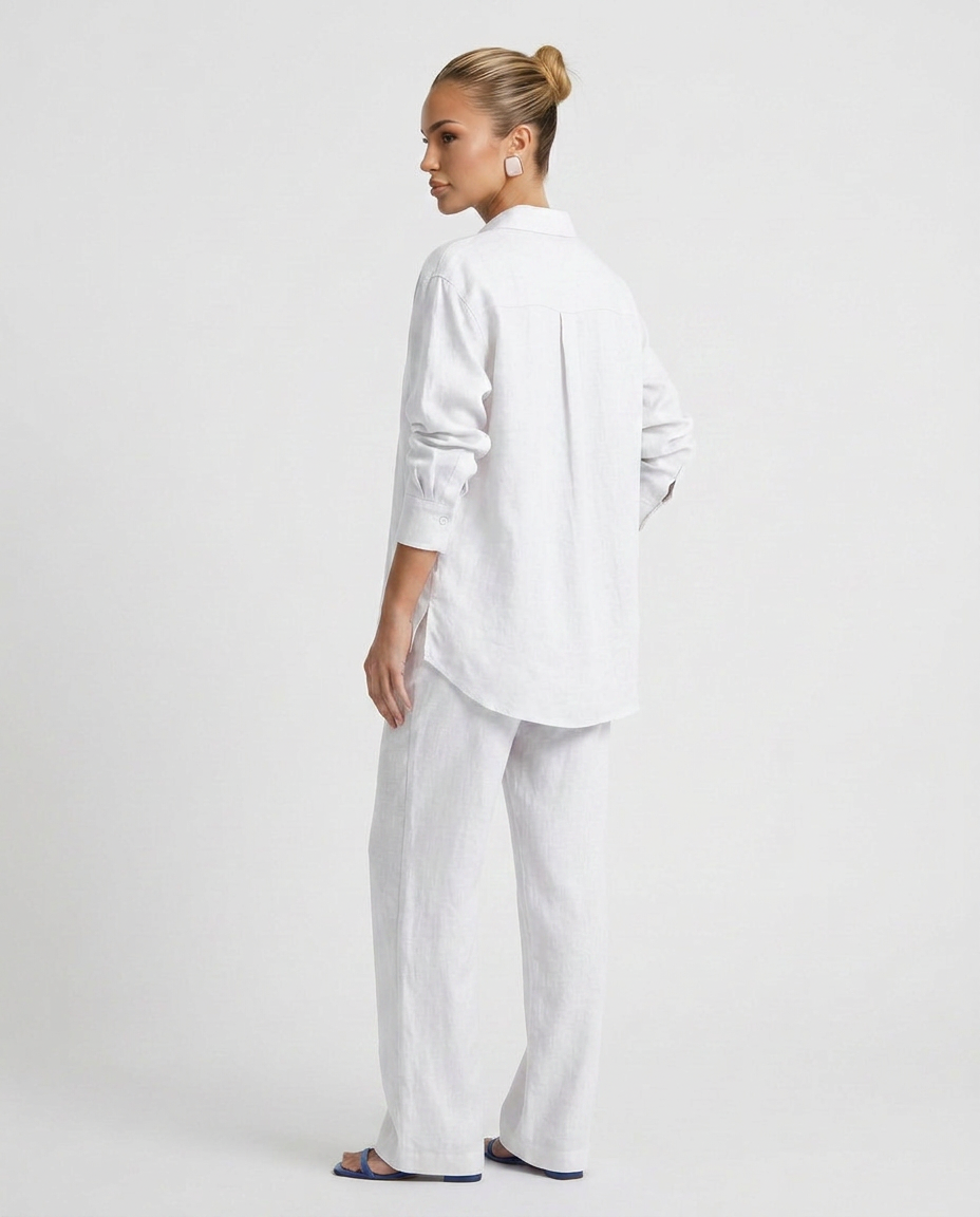 White two-piece button-up set with long-sleeve back button shirt and relaxed pants