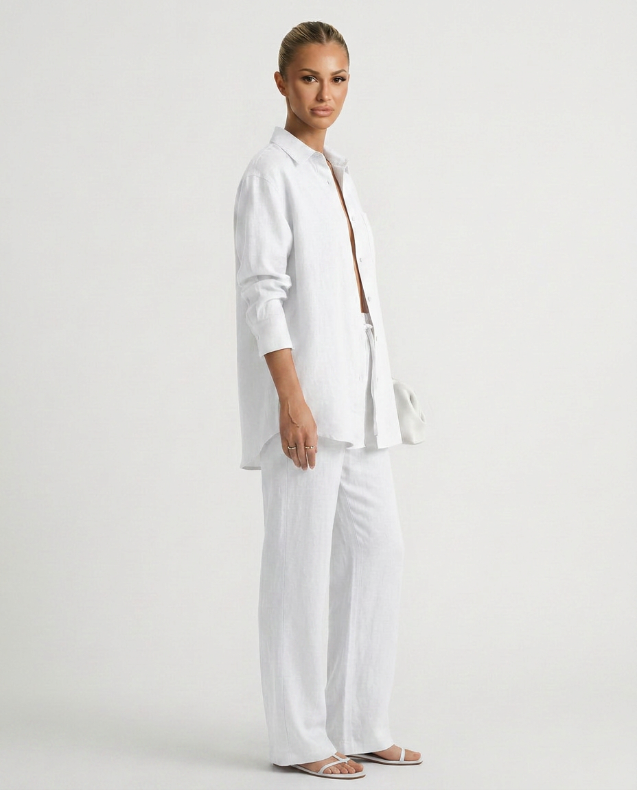 White two-piece button-up set with long-sleeve button shirt and relaxed straight pants
