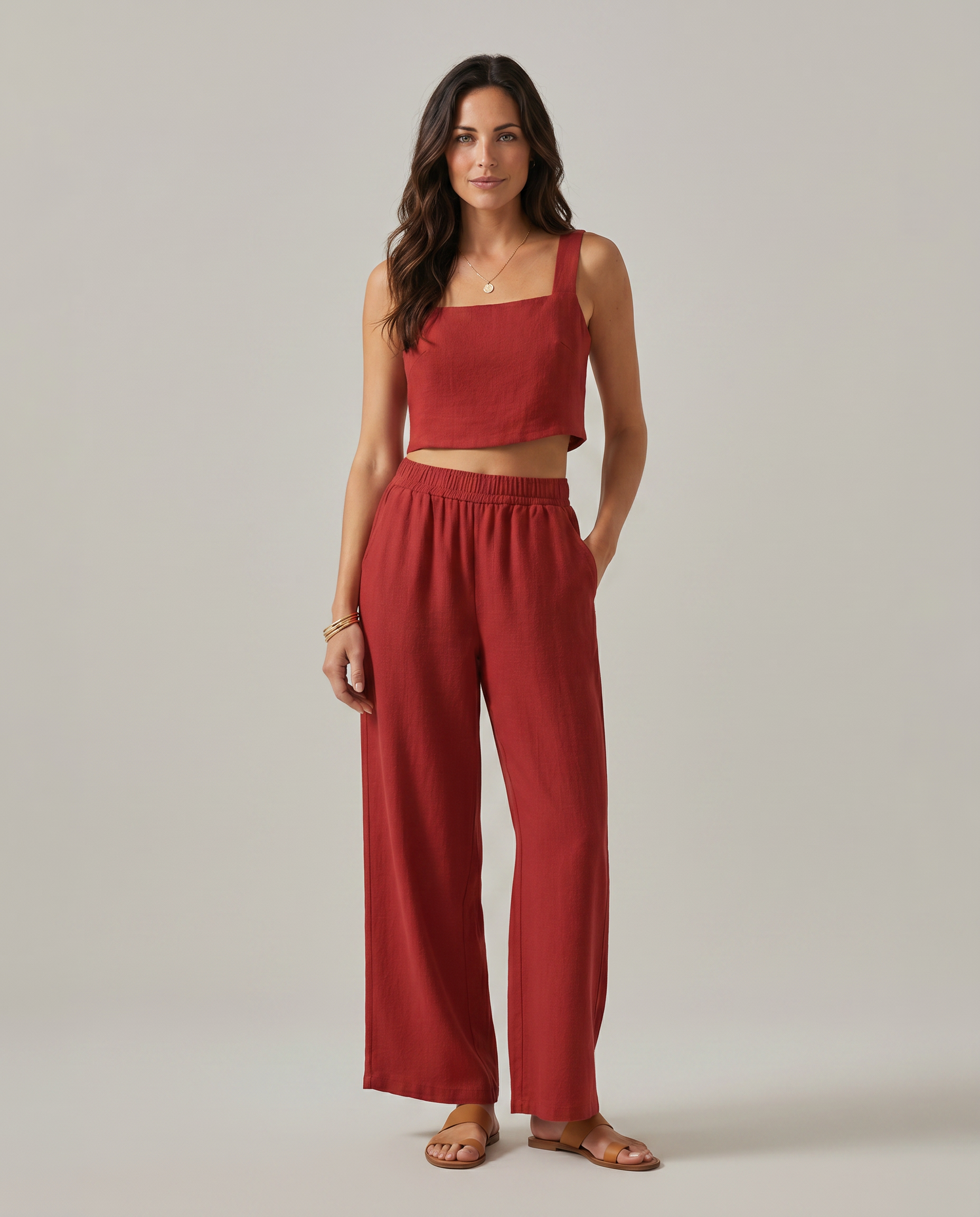 Wide-leg two-piece set in red: square-neck cropped tank and high-rise elastic-waist pants.