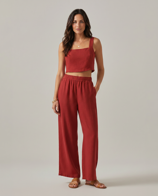 Wide-leg two-piece set in red: square-neck cropped tank and high-rise elastic-waist pants.