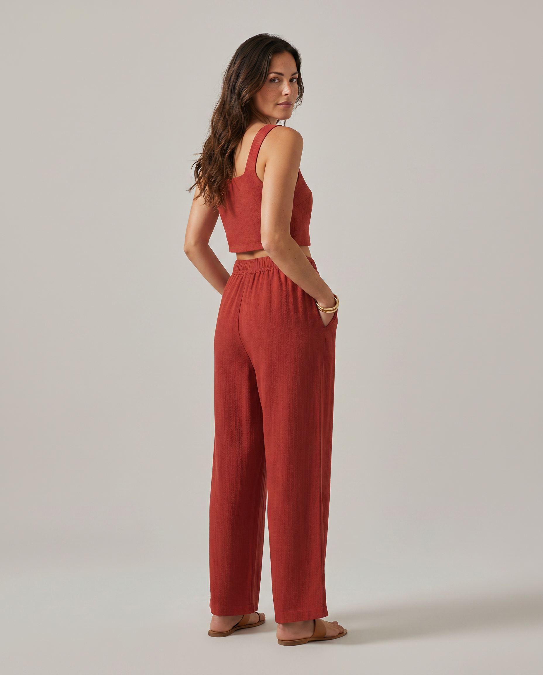 Red wide-leg two-piece set with square-neck cropped tank and gathered elastic-waist pants.