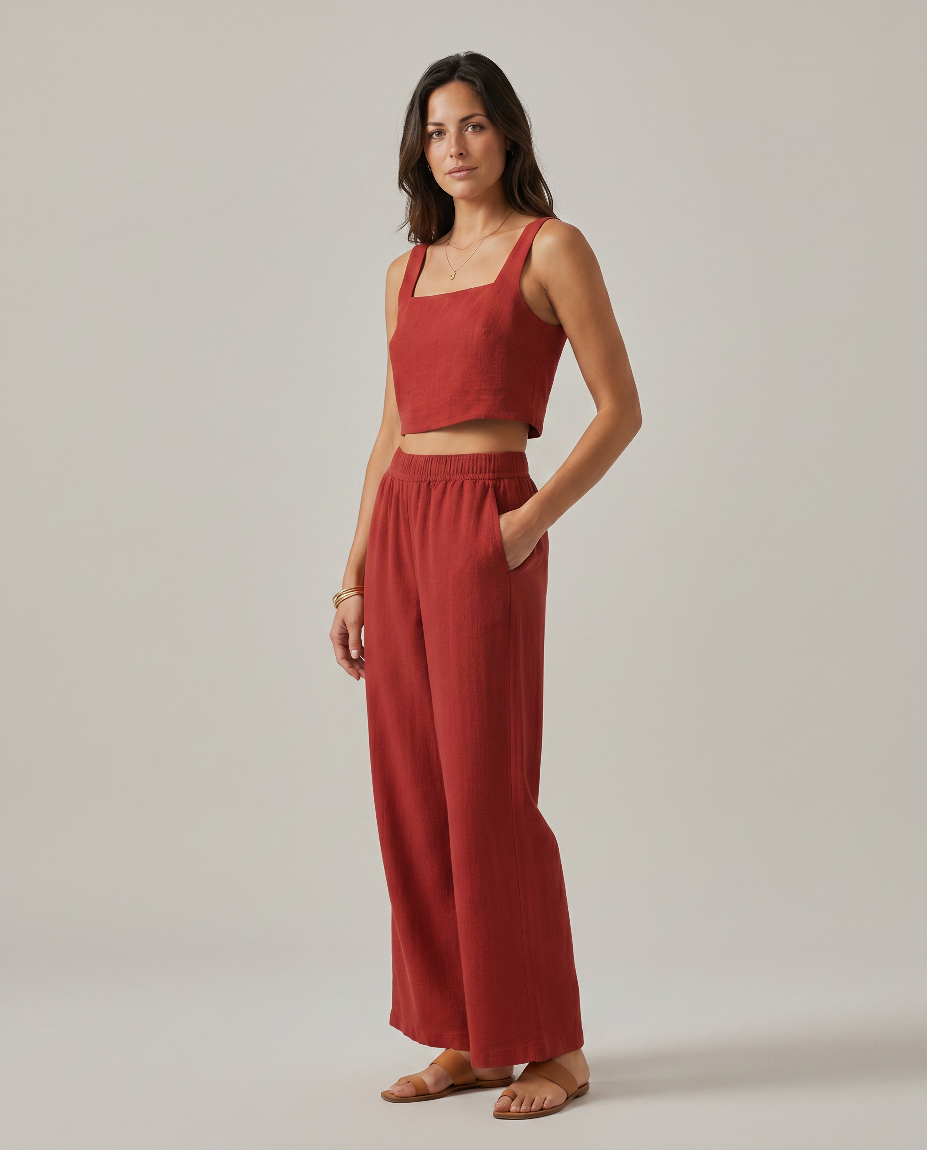 Red wide-leg two-piece set: square-neck crop top and flowy elastic-waist wide-leg trousers.