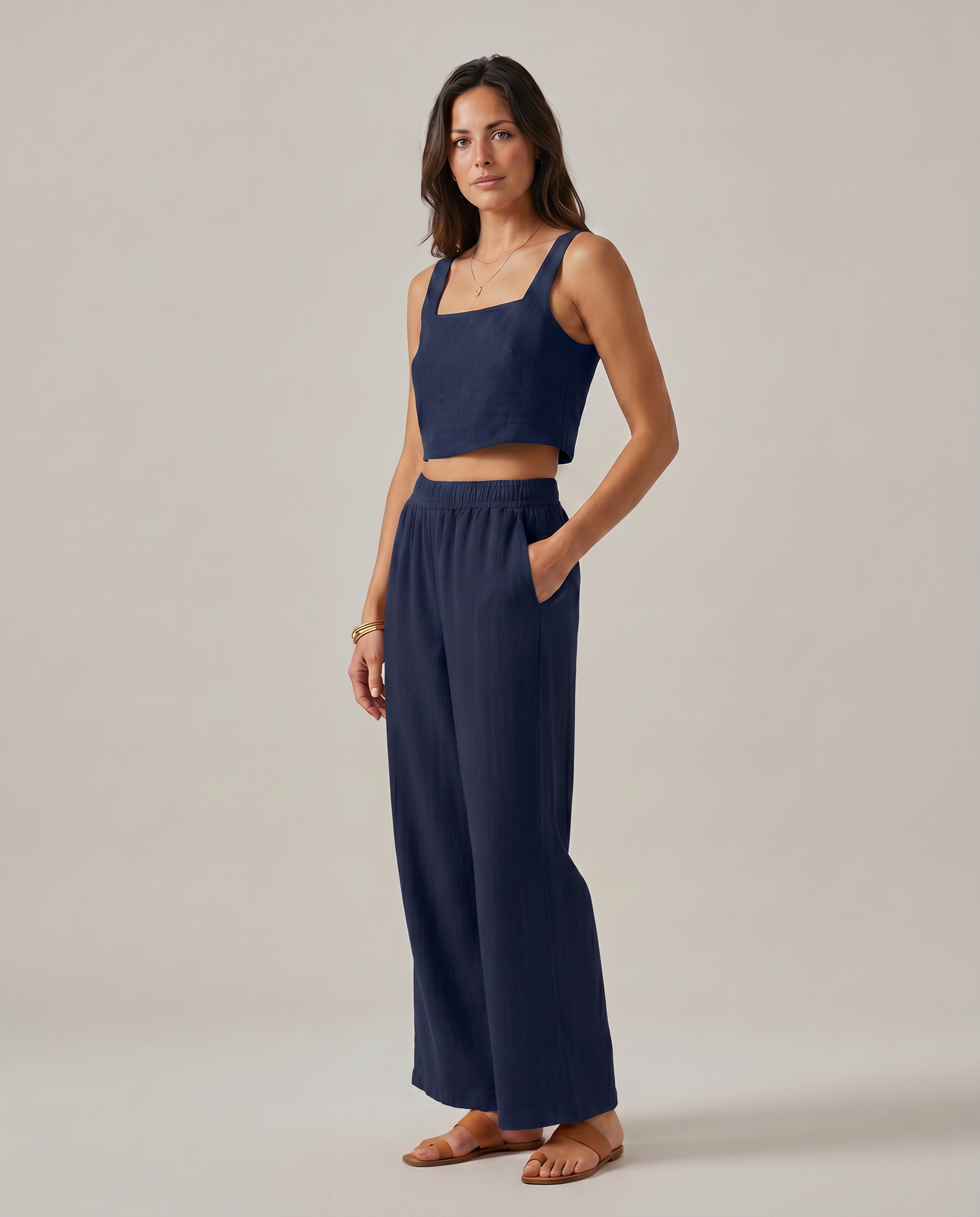 Navy wide-leg two-piece set: square-neck crop top and flowing elastic-waist wide-leg trousers.