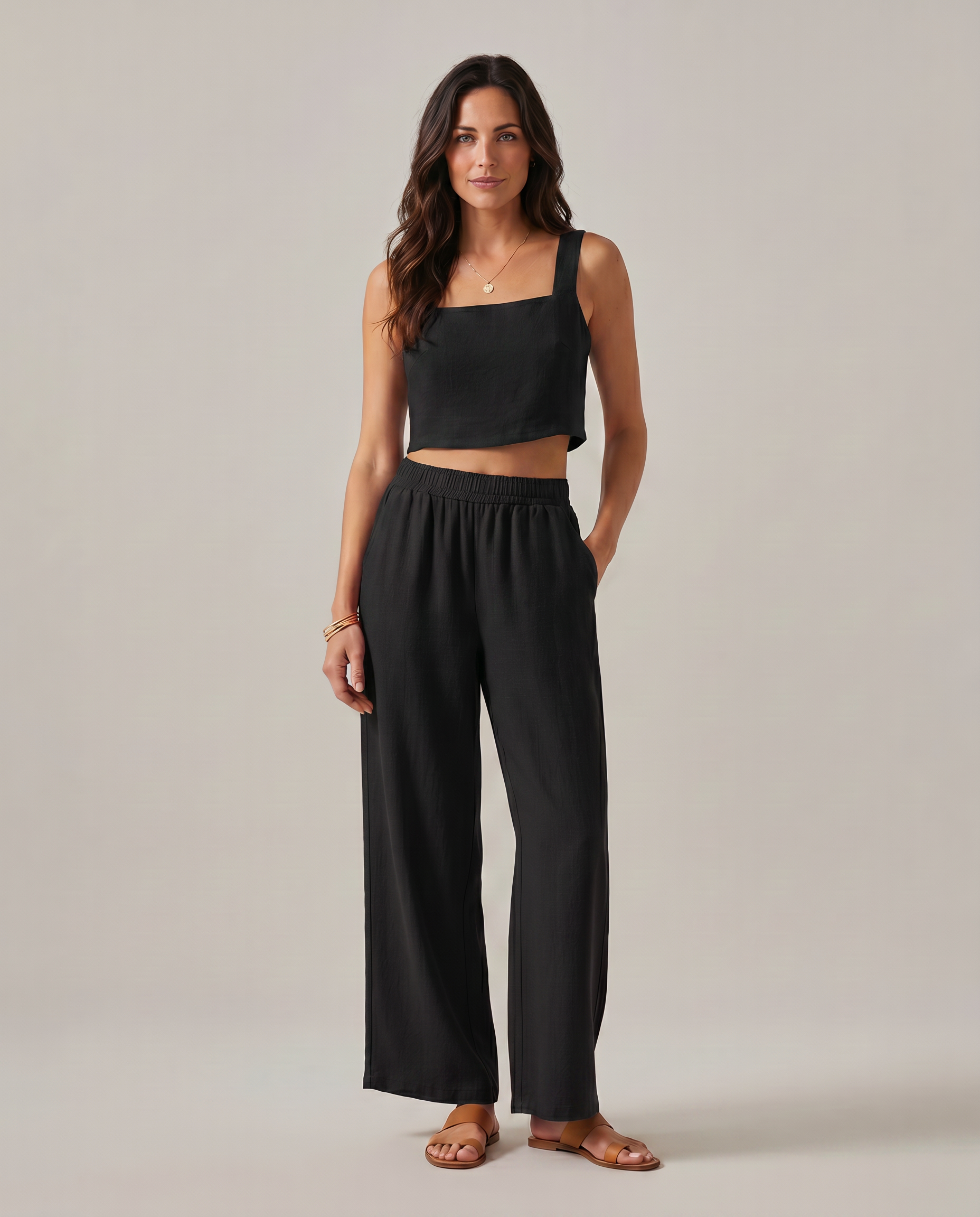 Wide-leg two-piece set in black: square-neck cropped tank and elastic-waist wide-leg pants.
