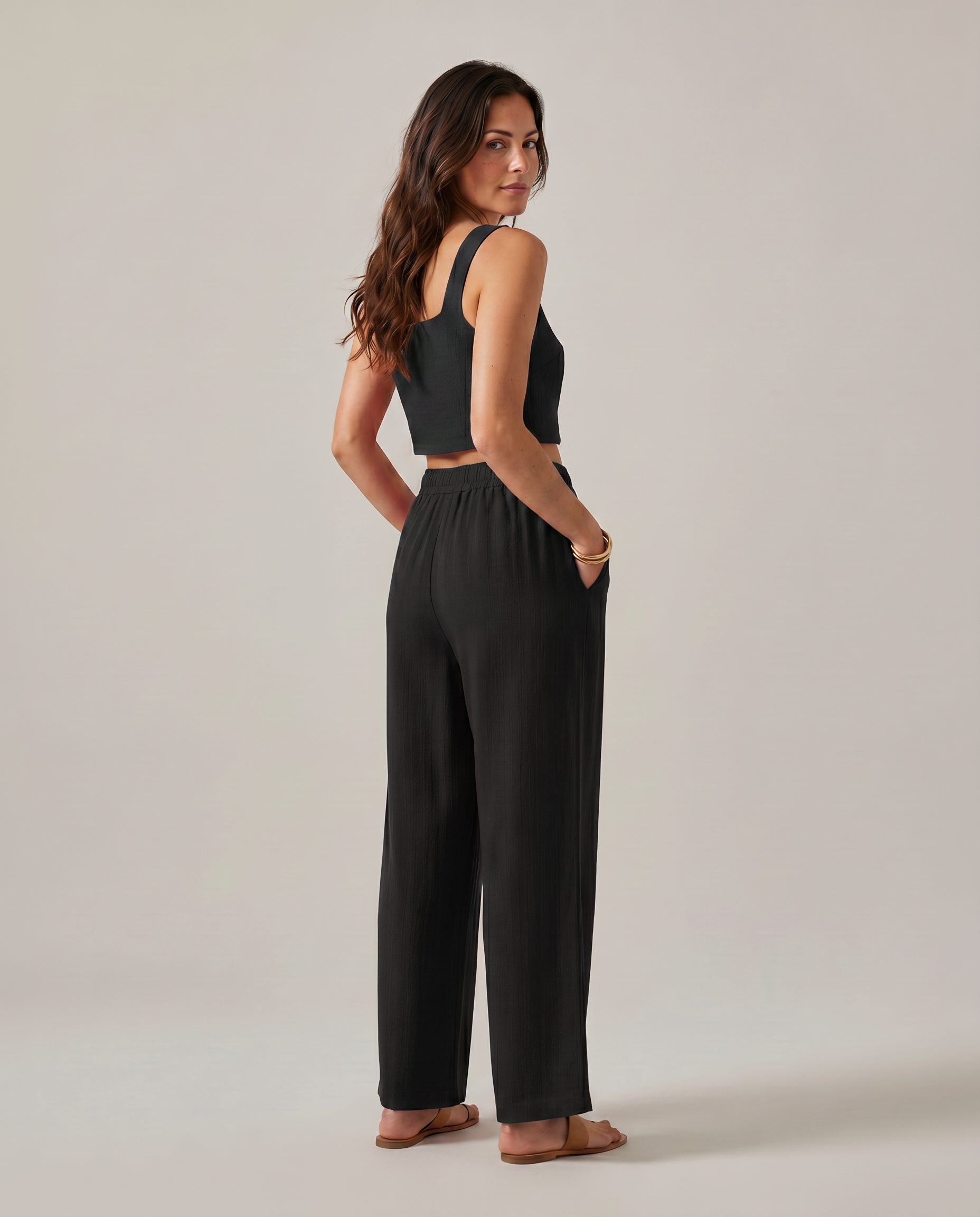 Black wide-leg two-piece set with square-neck cropped tank and gathered elastic-waist pants.