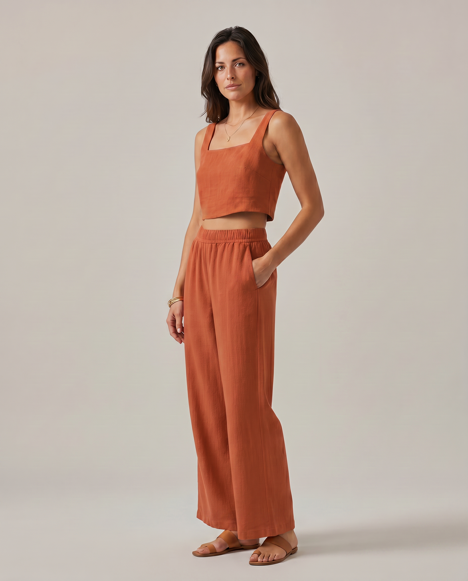 Rust orange sleeveless set with square-neck tank and wide-leg smocked waist pants