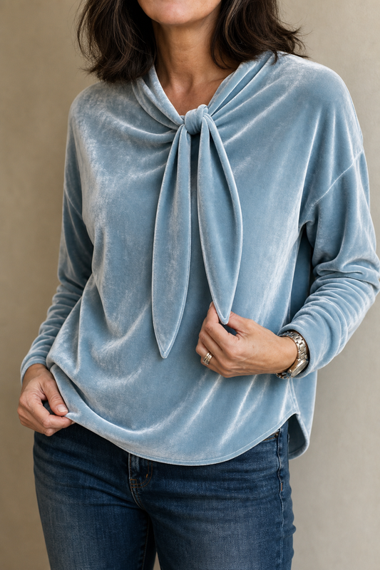 Light blue velvet tie-neck blouse with long sleeves and a relaxed fit