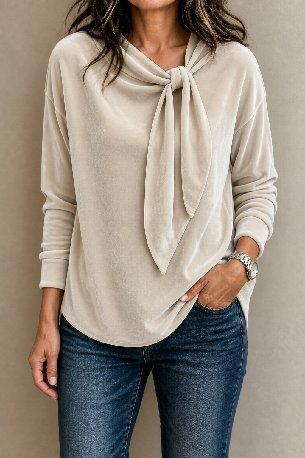 Light beige velvet blouse with a relaxed fit, long sleeves, and a draped tie neckline