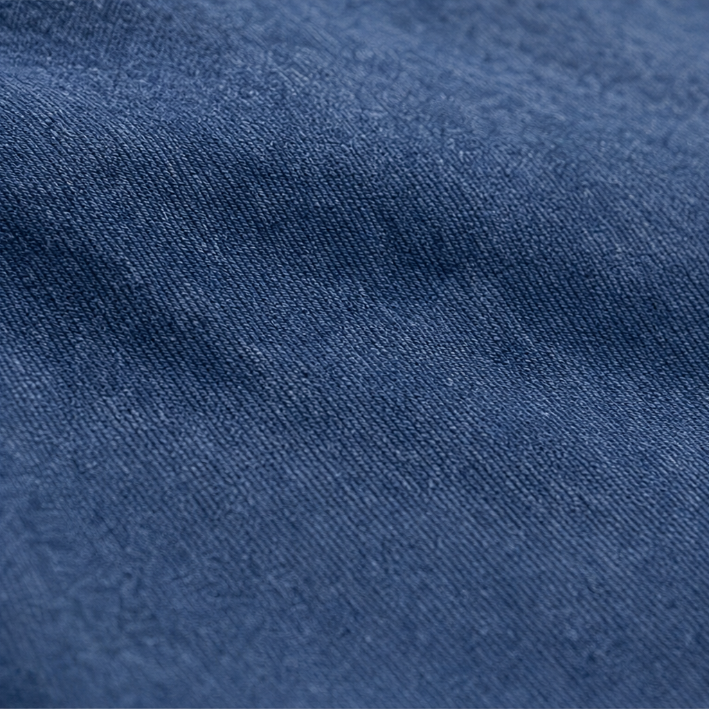 Blue denim-look hoodie fabric close-up with washed texture