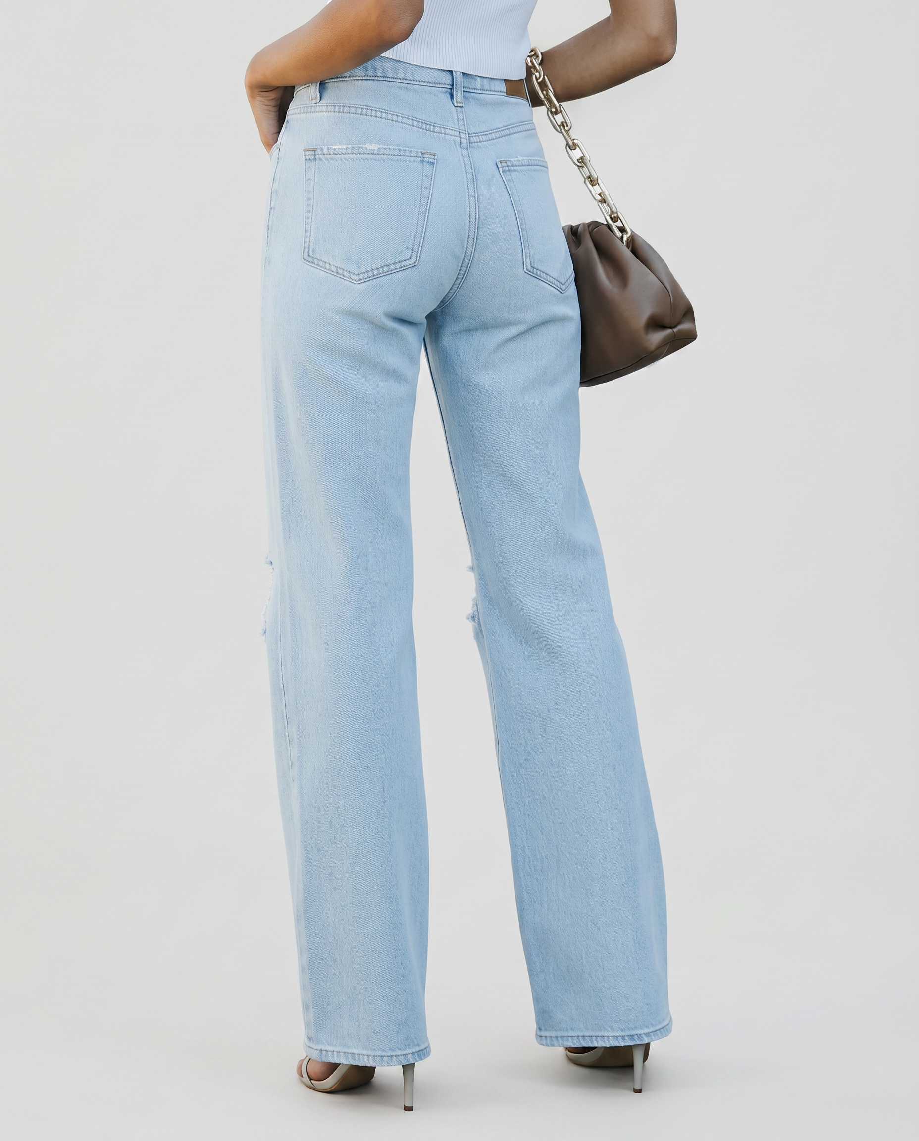 Light blue high-rise wide-leg jeans, back view with patch pockets and belt loops