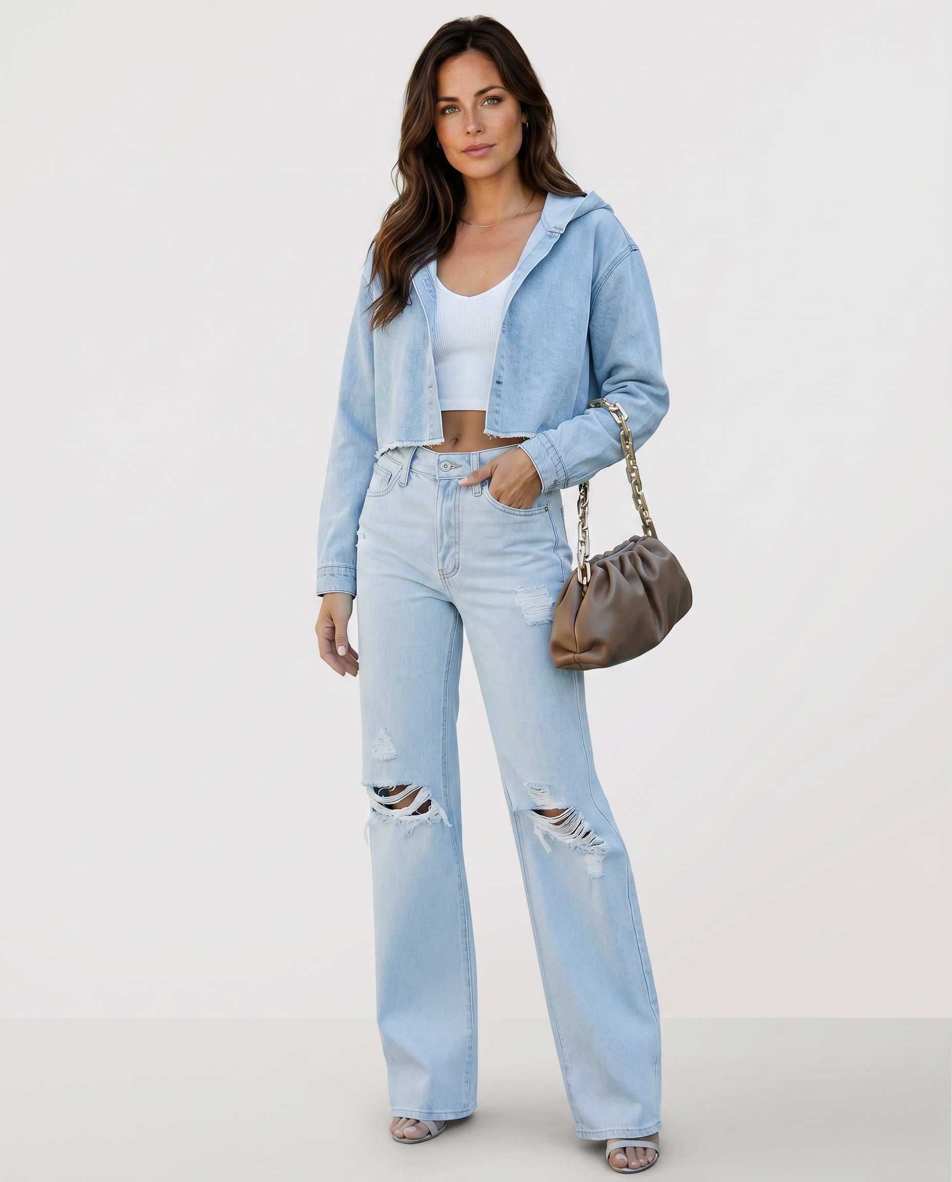 Light blue high-rise wide-leg jeans with ripped knees and relaxed straight flare