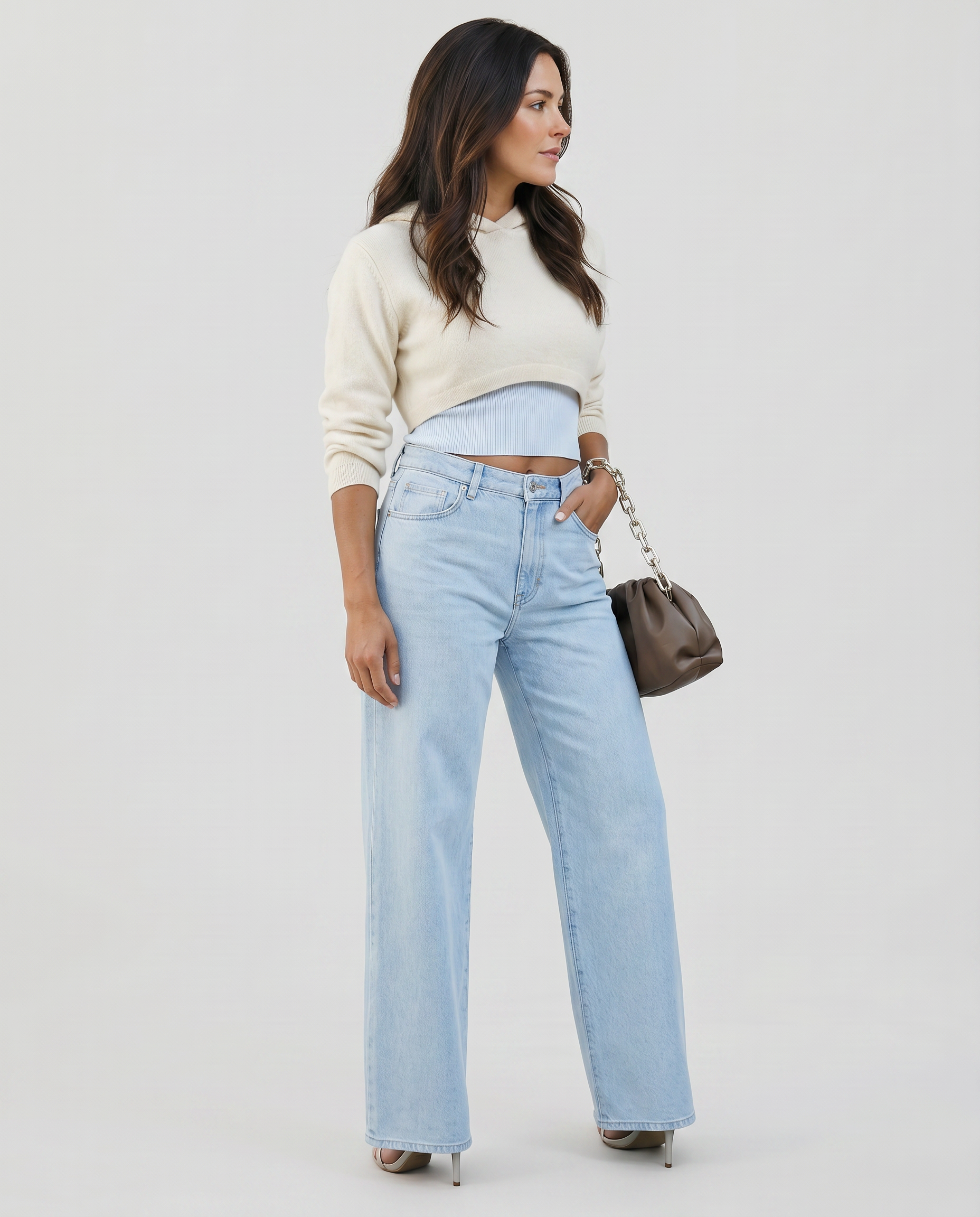 Light blue high-rise wide-leg jeans with ripped knee panels and wide straight legs