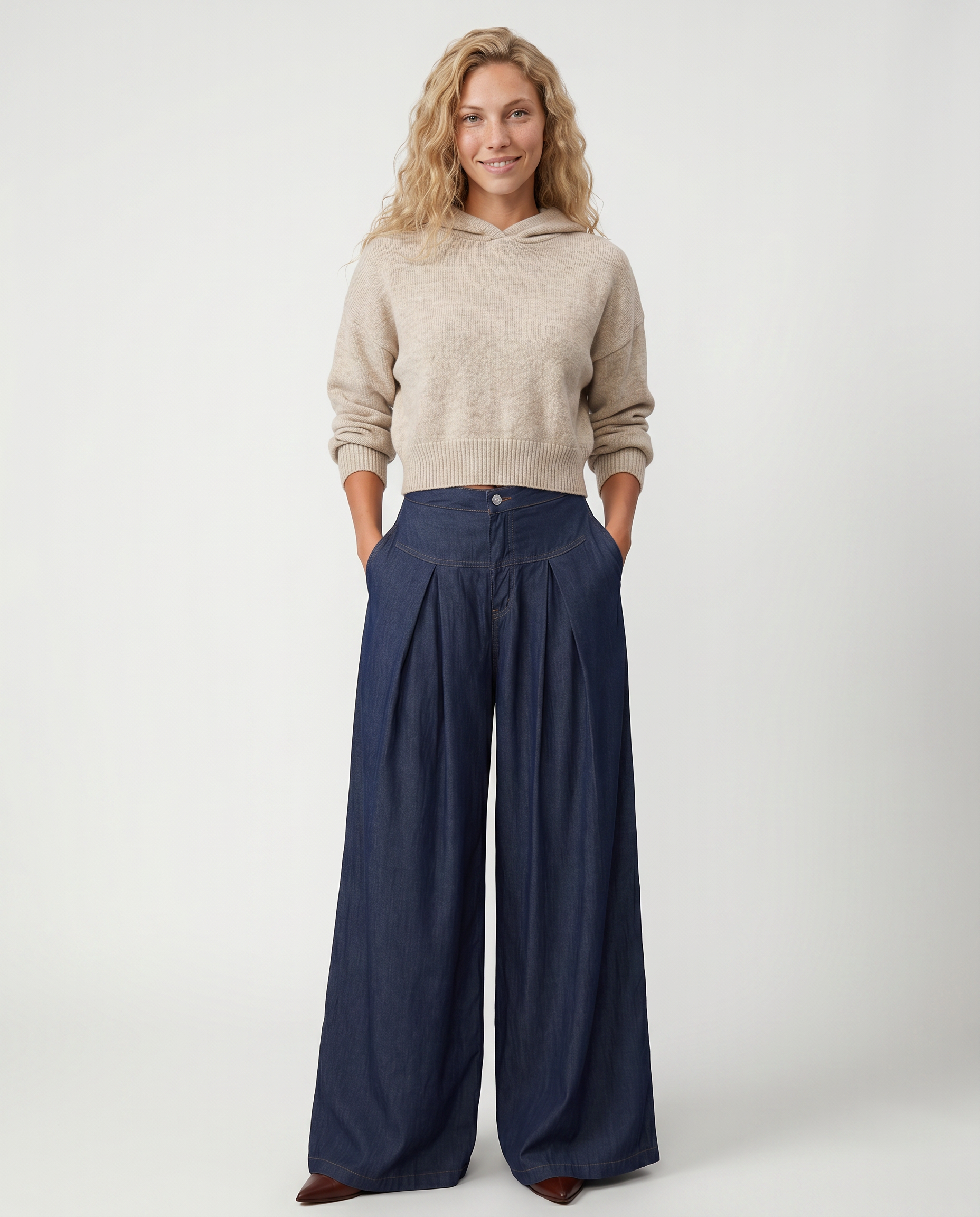 Navy denim wide-leg jeans with front pleats, button fly, and roomy leg