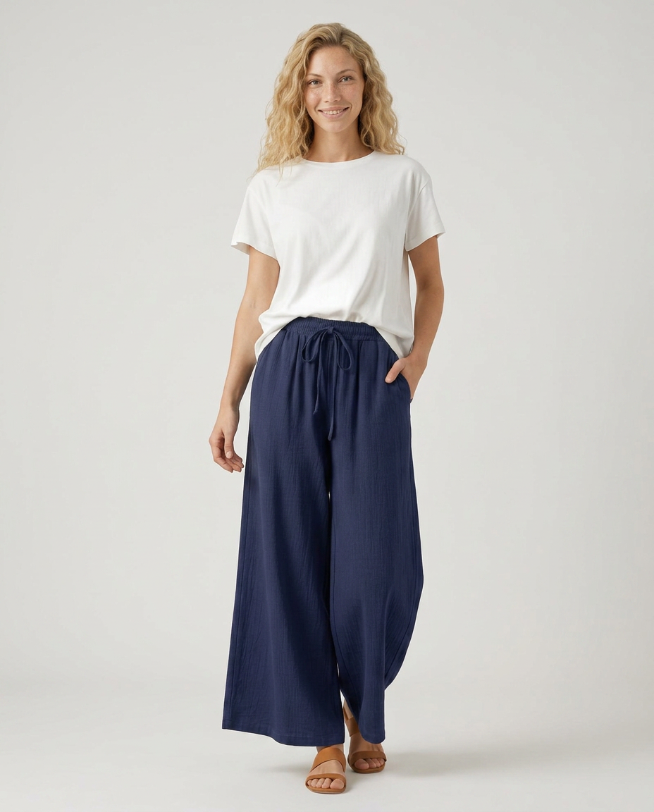 Navy wide-leg drawstring trousers with elastic waist, side slit hems