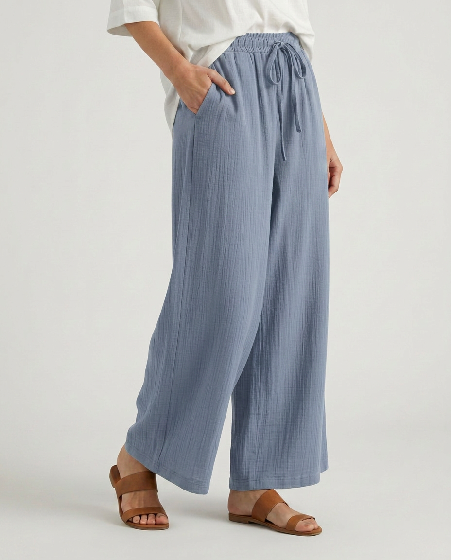 Light blue wide-leg drawstring trousers with elastic waistband and tie details