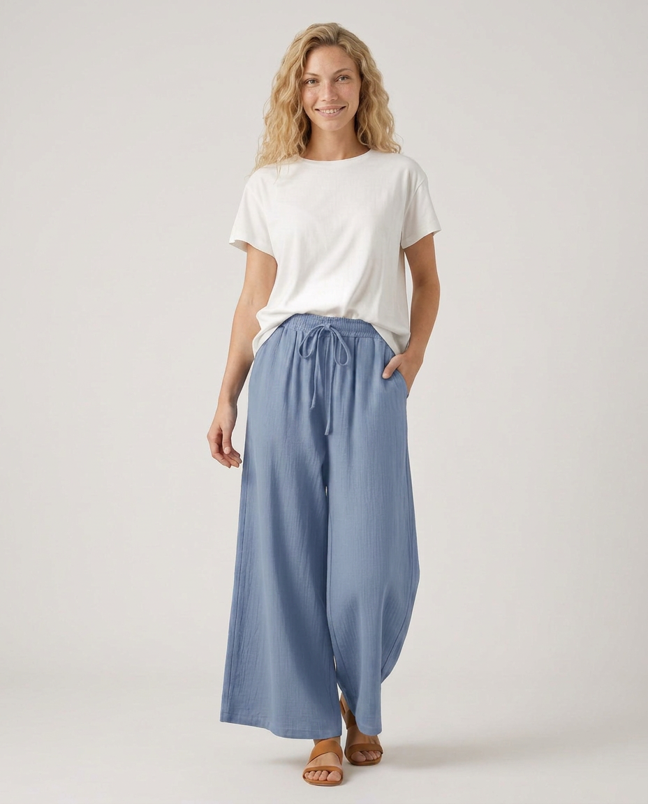 Light blue wide-leg drawstring trousers with gathered waist and wide legs