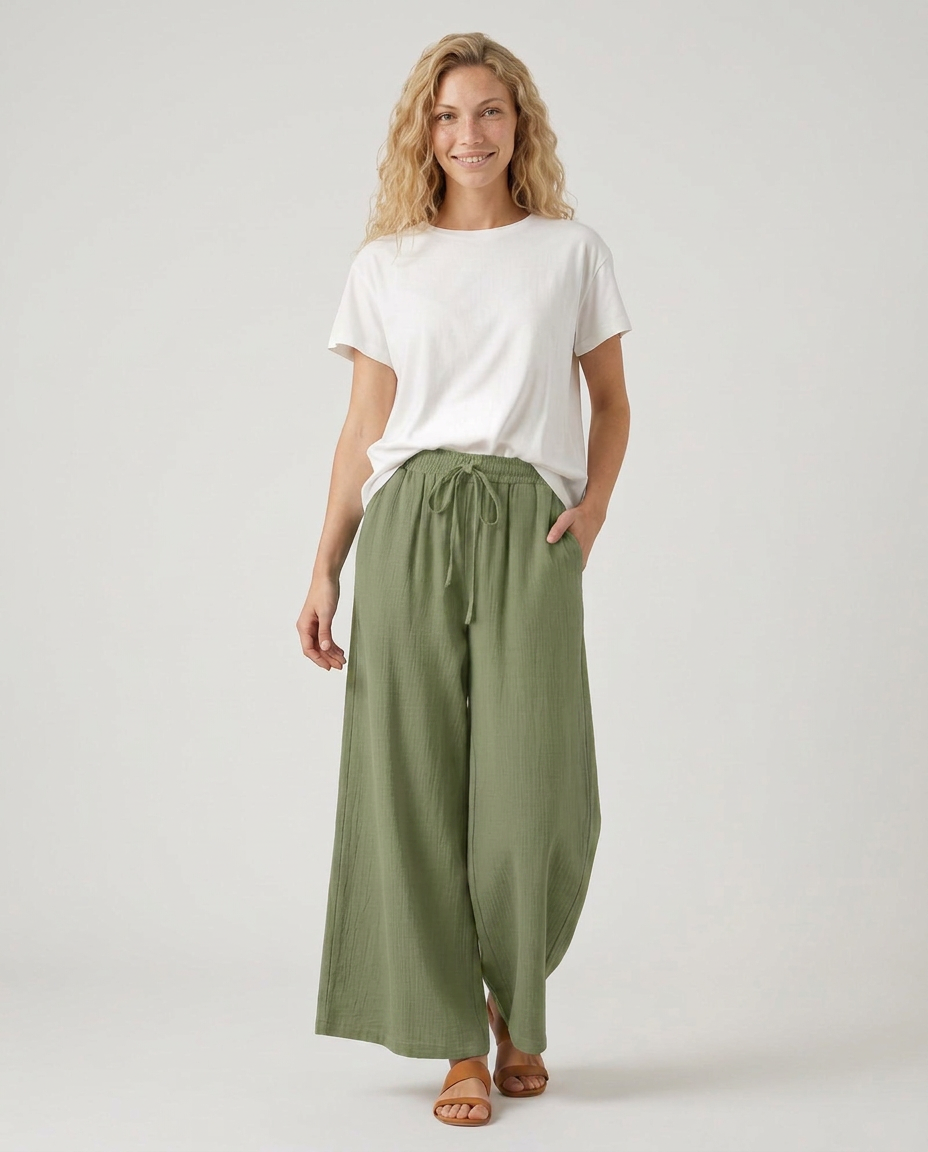 Olive green wide-leg drawstring trousers with gathered waistband and wide hem