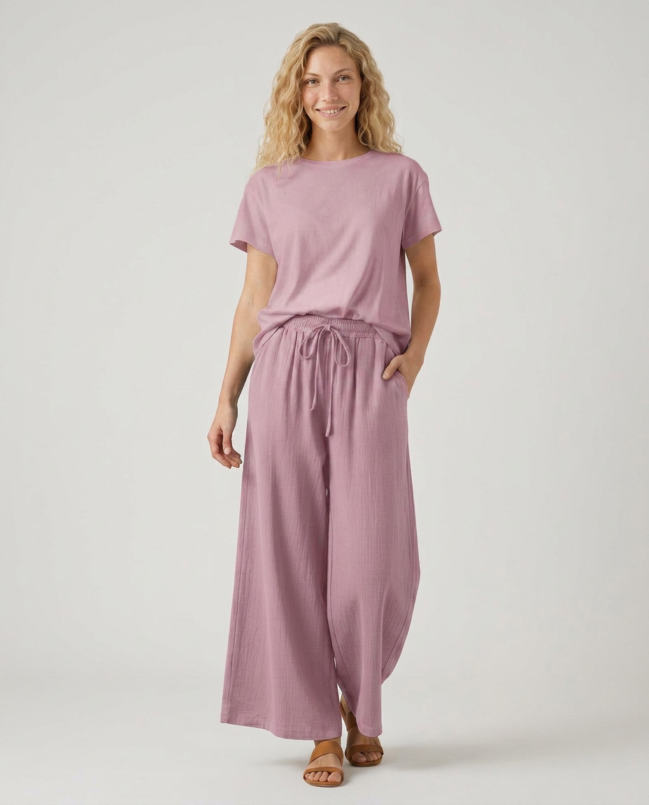 Purple wide-leg drawstring trousers with elastic waist and relaxed ankle-length legs