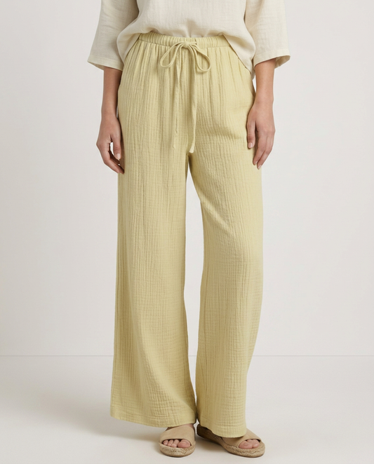 Yellow wide-leg trousers with elastic waist and drawstring, textured crinkled fabric