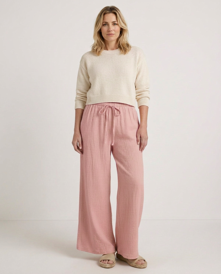 Soft pink wide-leg trousers with elastic waist and drawstring, front view full length