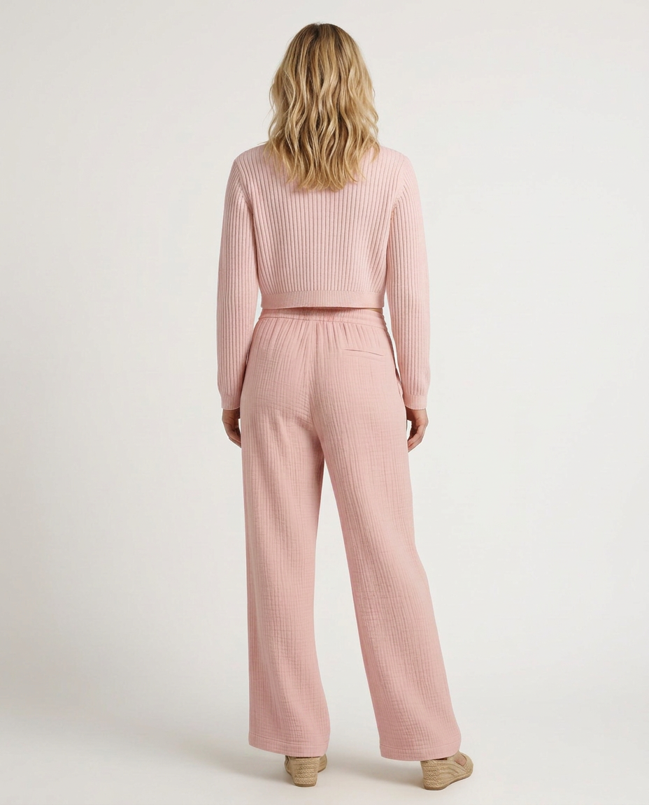 Pink wide-leg trousers with elastic waistband and drawstring ties