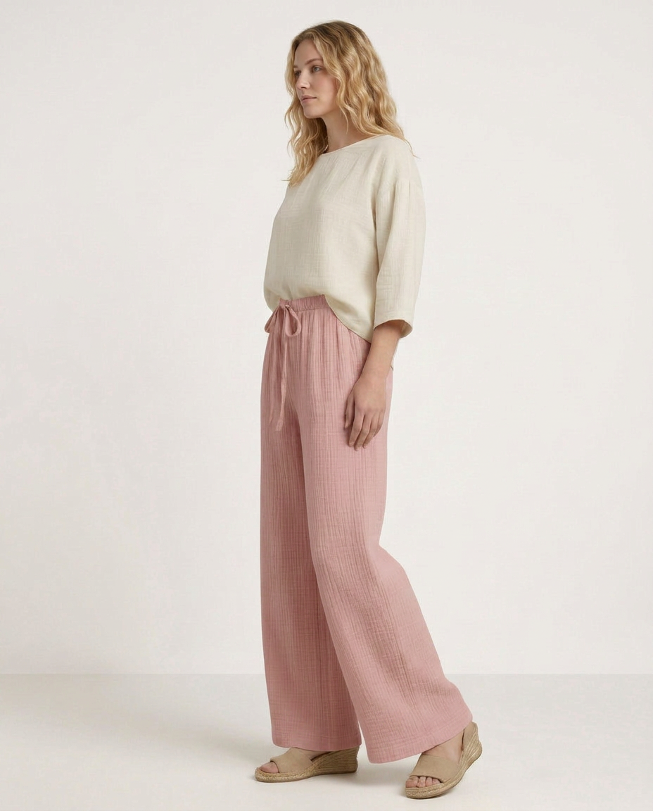 Mauve wide-leg trousers with elastic waistband and soft drape