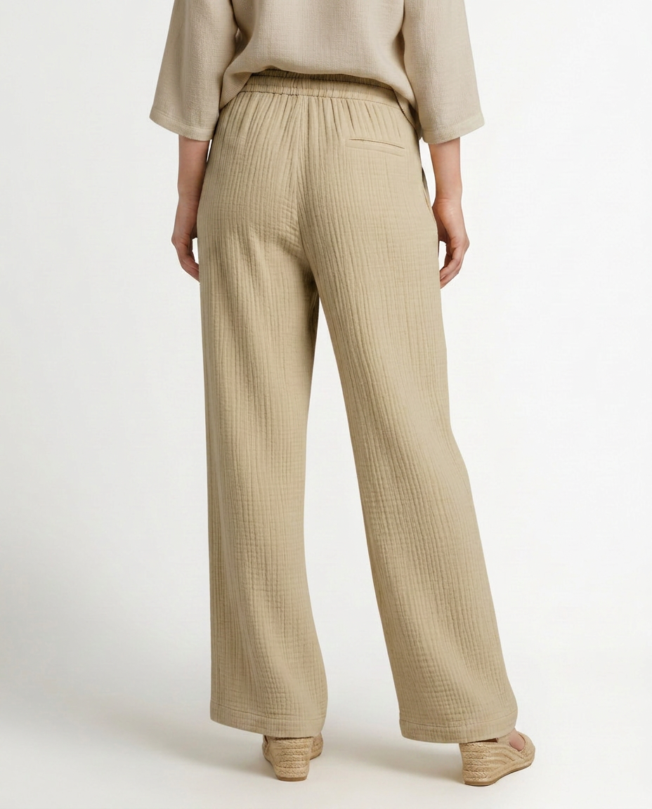 Beige wide-leg trousers with elastic waistband and straight wide legs