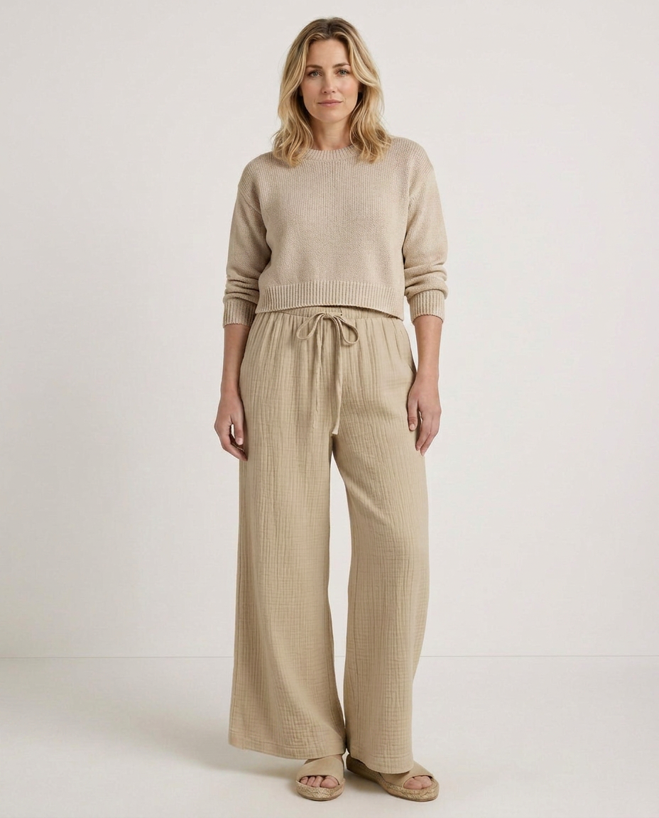 Tan wide-leg trousers with elastic waistband and drawstring ties