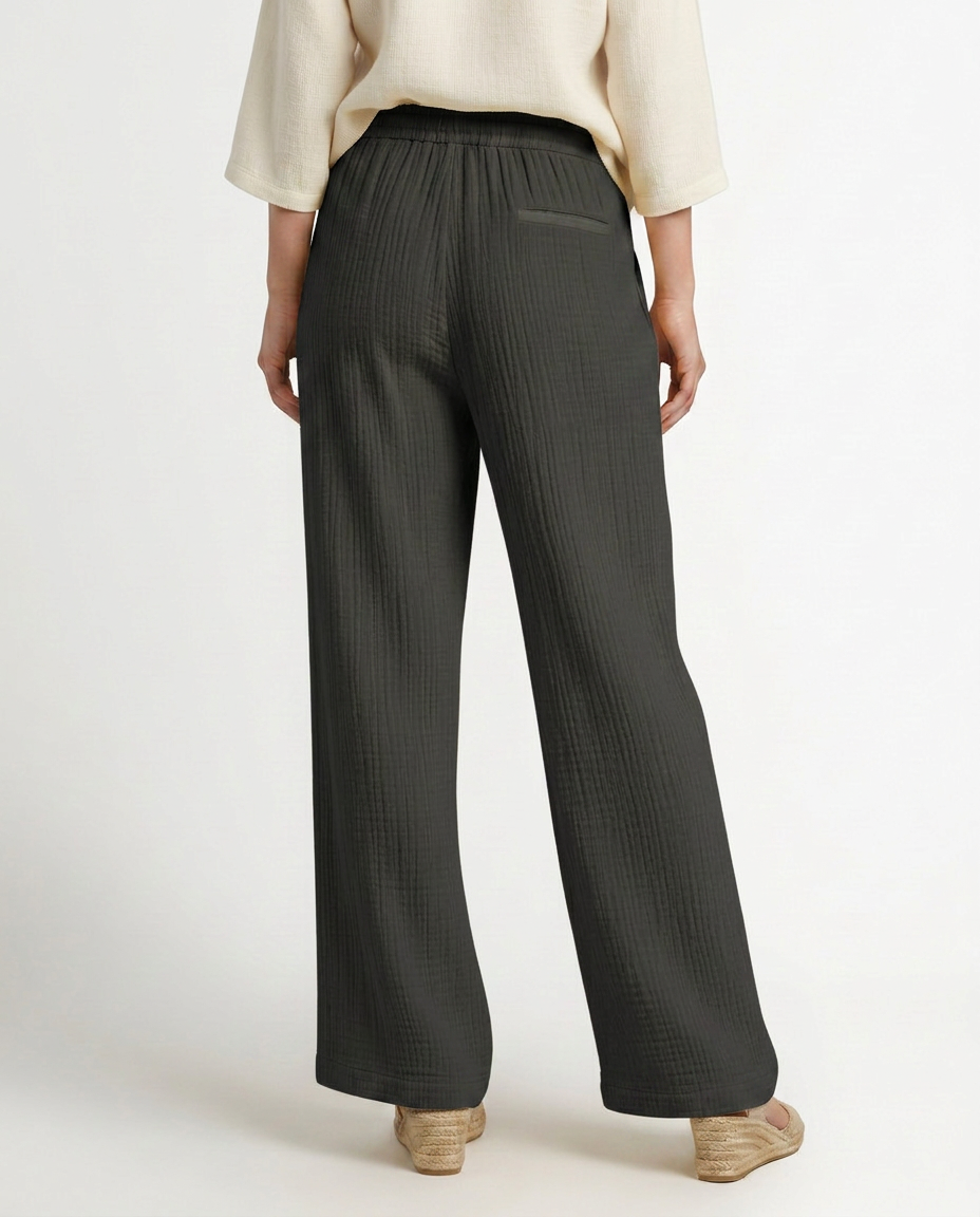 Dark charcoal wide-leg trousers with elastic waist and relaxed straight legs