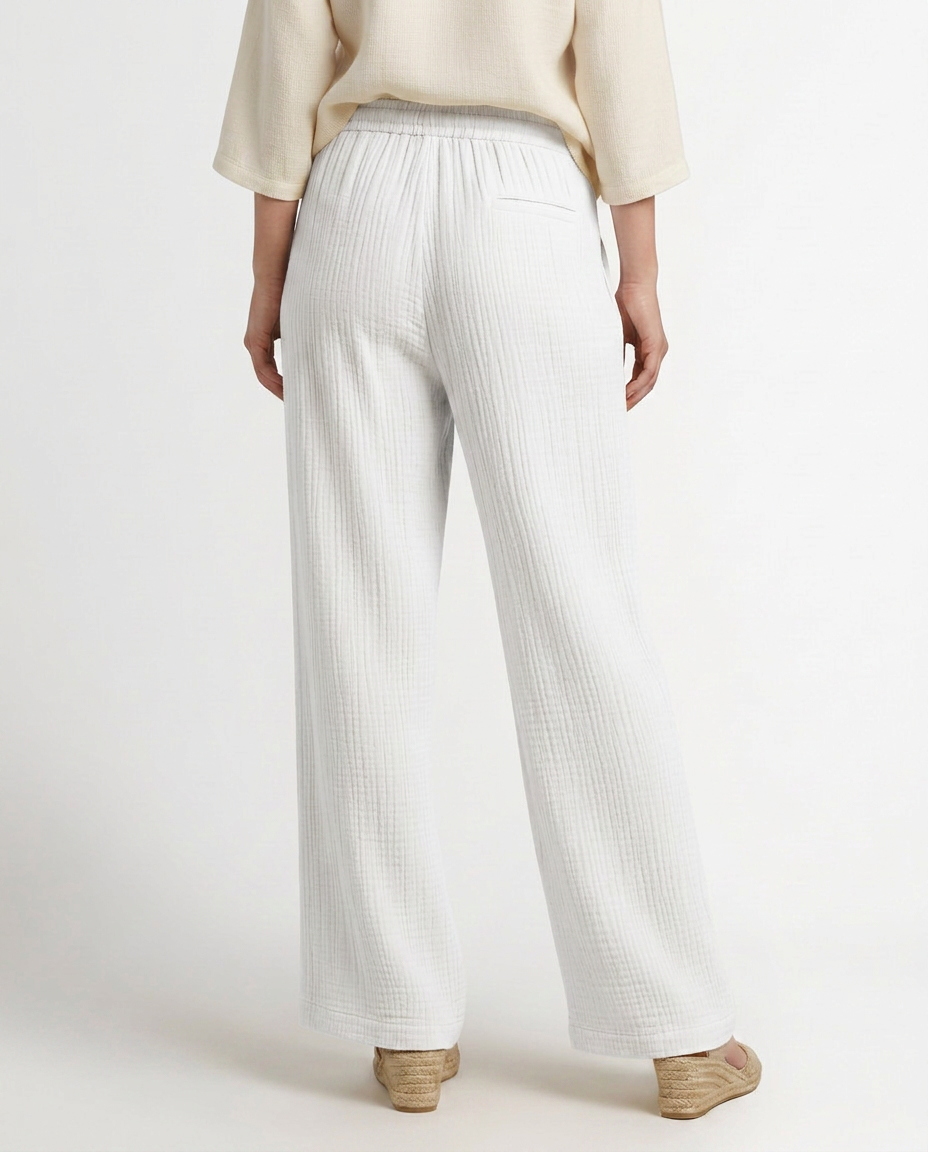 White wide-leg trousers with elastic waistband, drawstring, textured fabric