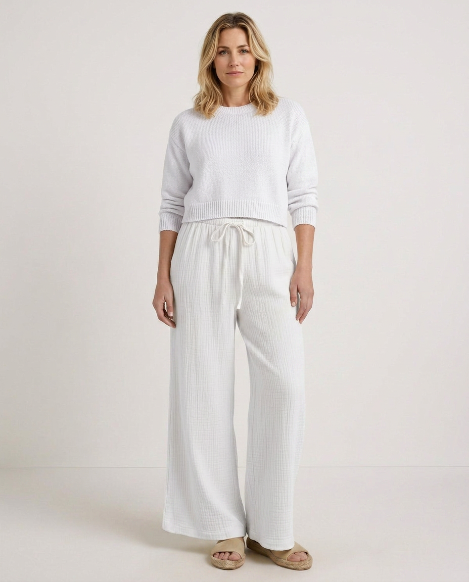 White wide-leg trousers with elastic waist and drawstring tie, loose straight legs