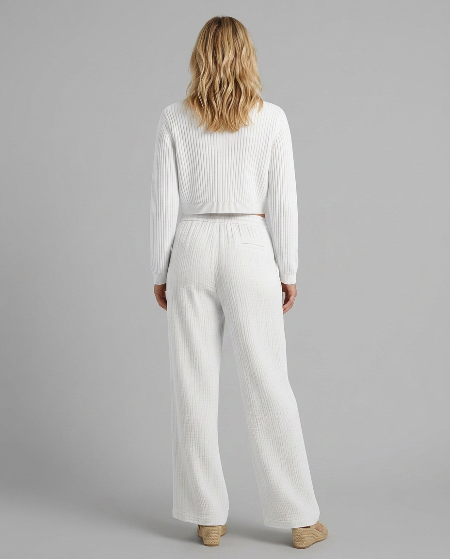 White wide-leg trousers, back view, elastic waistband with drawstring, textured