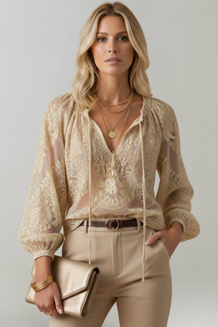Beige lace blouse with tied V-neck and long puff sleeves; embroidered lace pattern