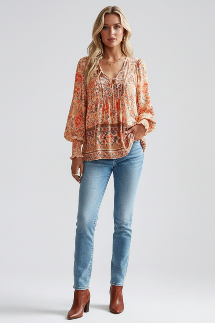 Orange floral long-sleeve blouse with V-neck and gathered ruffled cuffs