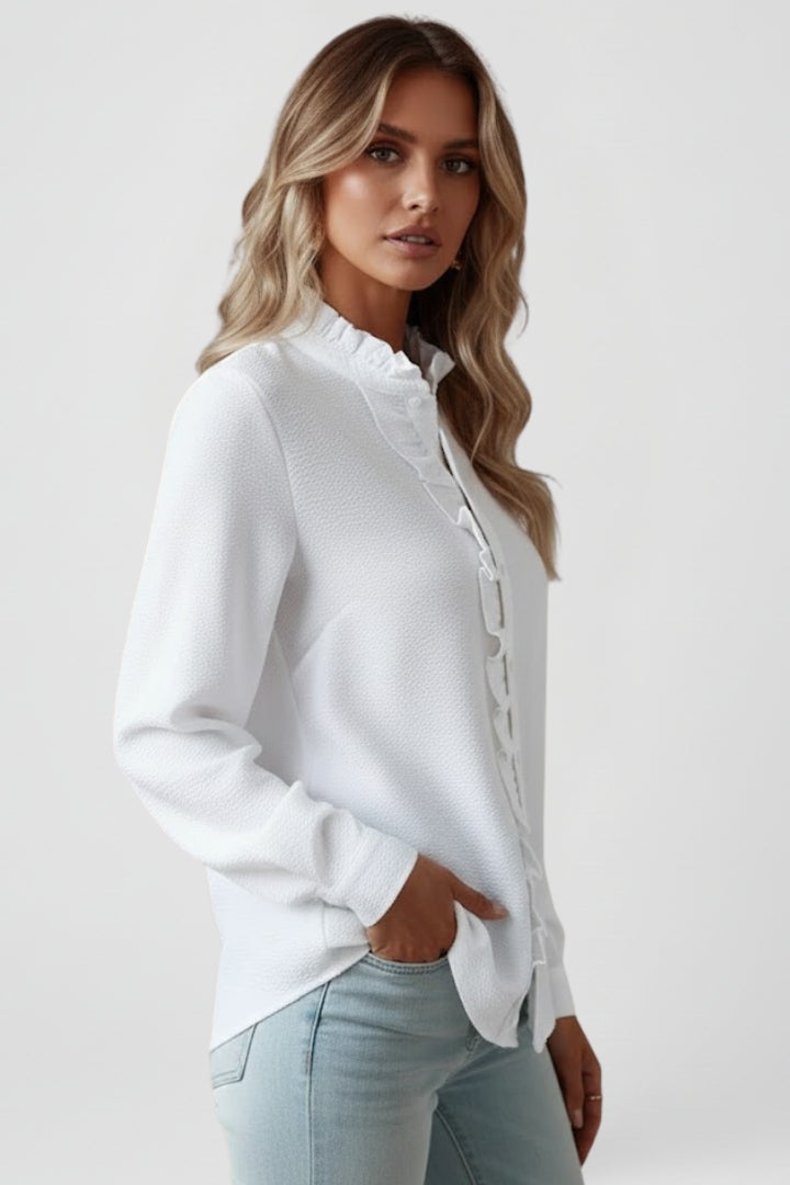 White long-sleeve blouse with ruffled placket and high neckline